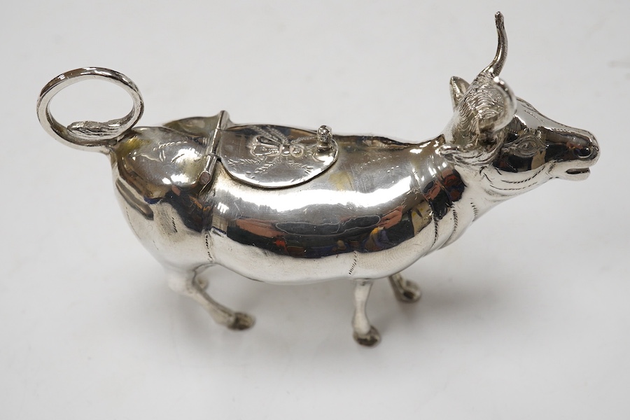 Assorted small silver including a cigarette case, set of four Victorian salts by Thomas Bradbury & Sons, London, 1878, a sterling cow creamer and three condiments. Condition - fair to good